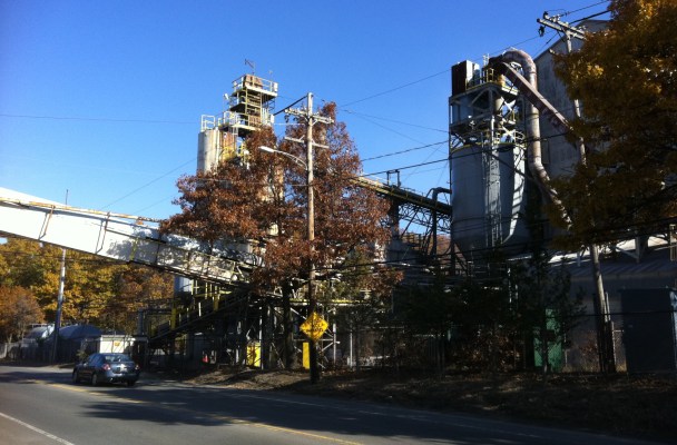 A factory building by the side of a road in Norwood MA.