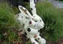 The Regal Rabbit is a giant fiberglass rabbit covered with swirly lines, circles, and glitter.