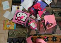 Papers and toys scattered on a rug.