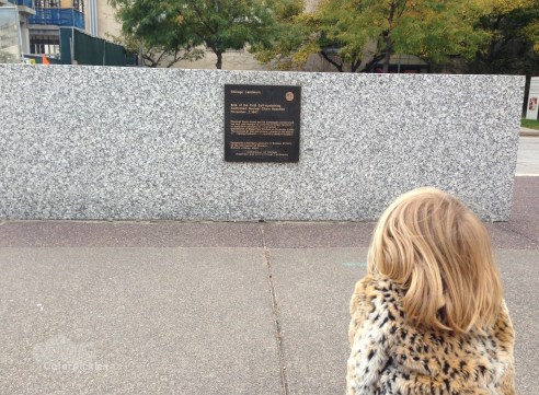 The Six-Year-Old studies a sign on the University of Chicago campus. (Photo: Shala Howell)