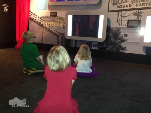 The Six-Year-Old and her buddies watch a short film at the Disney exhibit at the Museum of Science & Industry. (Photo: Shala Howell)