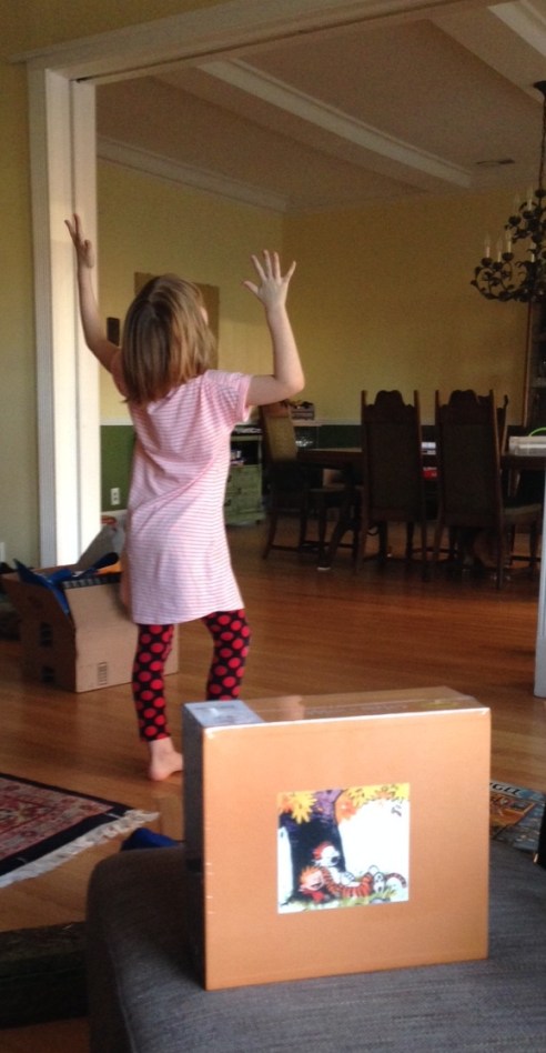 The Eight-Year-Old, celebrating the arrival of her new Calvin & Hobbes box set. (Photo: Shala Howell)