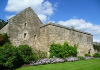 Ancient stone building with lovely gardens.