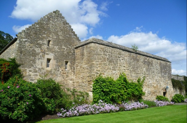 Ancient stone building with lovely gardens.