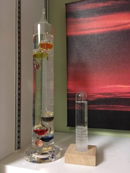 My retro weather center. The storm glass is on the right, making its bold prediction of cloudy skies in Chicago in winter. The glass tube on the left is Galileo's thermometer. We'll talk about how/if that sucker works some other time. (Photo: Shala Howell)