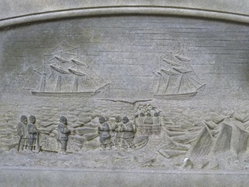 close-up of a dark grey stone plaque