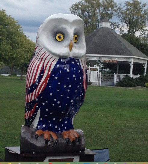 The Freedom owl is painted red, white, and blue, naturally. The owl's head is white, his wings striped red and white, and his blue belly is full of white stars. 