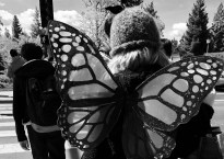 Rear View of my daughter dressed as Mothman crossing the street.