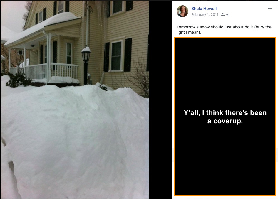 Picture shows a front yard that has been buried in snow. The snow reaches more than halfway up the lamp post in the middle of the yard.