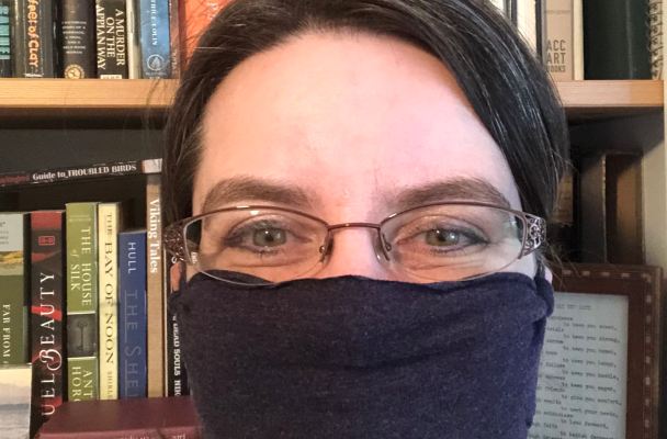 Photo of me wearing a no-sew mask made from one of my husband's old t-shirts.