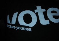 black t-shirt with words "Vote: Declare yourself" on it