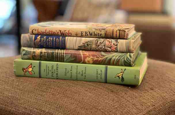Pile of hardback books, including Charlotte's Web, King Arthur and the Knights of the Round Table, The Jungle Book, and The Illustrated Treasury of Poetry for Children.