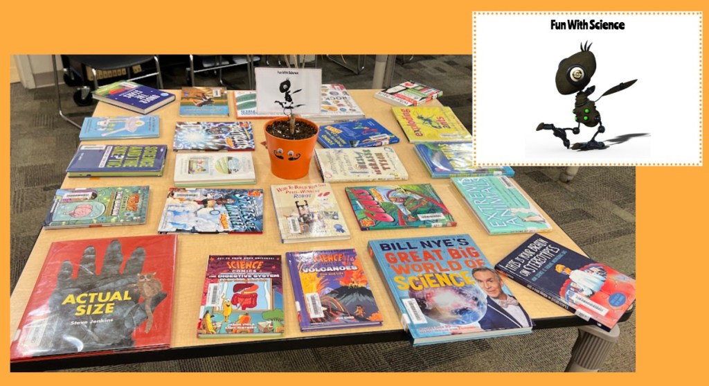 The Fun with Science table with a photo of some of the books spread out on the table, as well as a closeup of the table's sign, which shows a robotic ant walking. I found the image of the ant for the sign from Pixabay, a wonderful source of royalty-free images. 