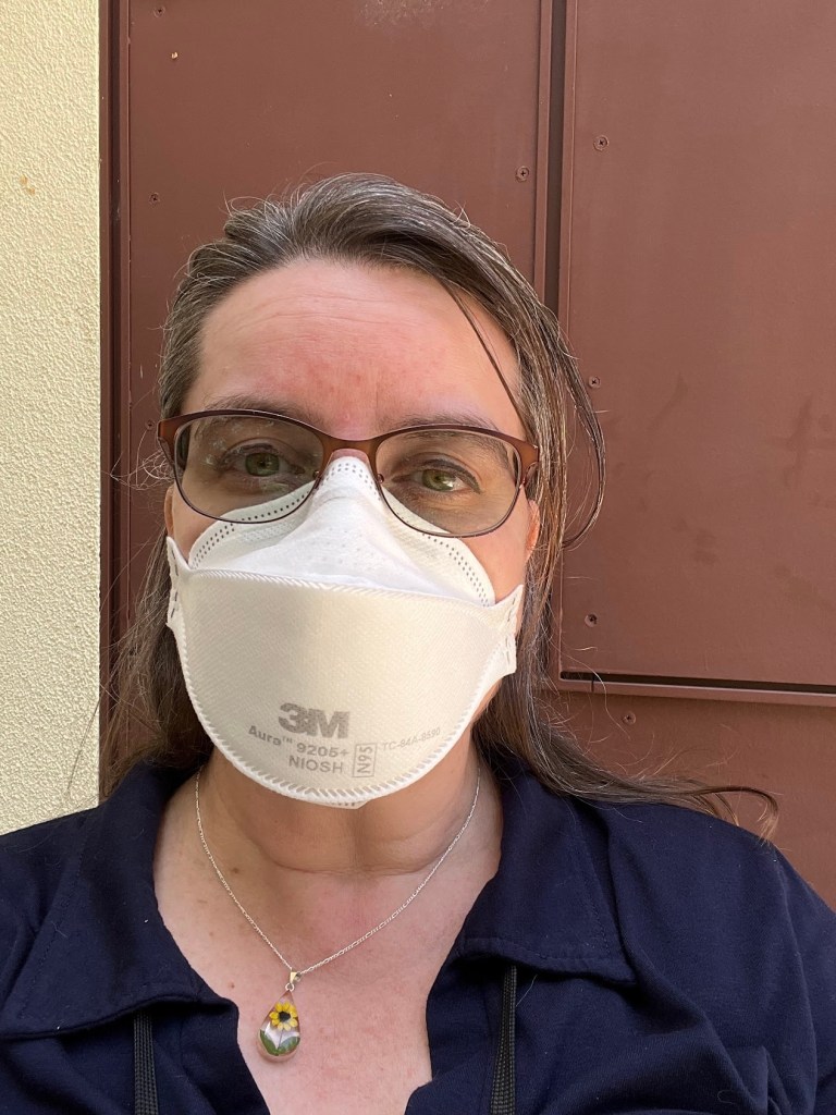 image shows me in an aura mask just outside the door to my library after taking my lunch break outside