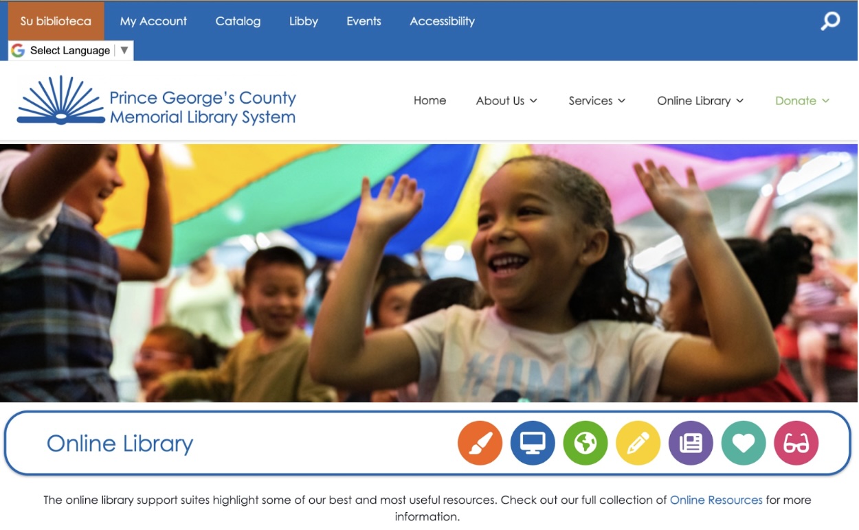 Image shows a snapshot of a home page with the standard menu bar across the top. The main portion of the page is taken up with a photograph of a smiling laughing group of kids playing under a rainbow parachute. Under the photograph are a line of simple icons representing options for using the site.